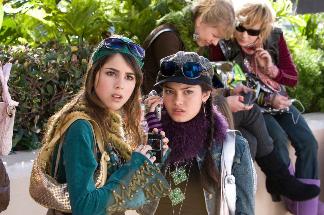 Daniella Monet as Inga Veinshtein and Kelly Vitz as Trish